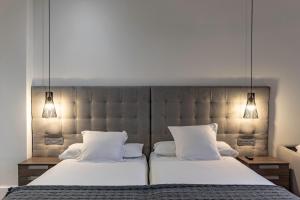 Кровать или кровати в номере Habitaciones Apartamento B&B Plaza Nueva 8