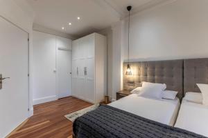Кровать или кровати в номере Habitaciones Apartamento B&B Plaza Nueva 8