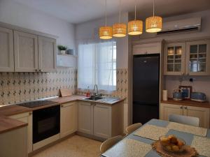 Kuchyň nebo kuchyňský kout v ubytování Summer Marsalforn Holiday Apartment