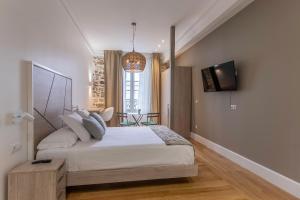 Кровать или кровати в номере Habitaciones Apartamento B&B Plaza Nueva 8