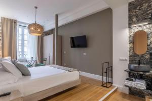Кровать или кровати в номере Habitaciones Apartamento B&B Plaza Nueva 8