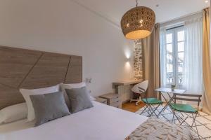 Кровать или кровати в номере Habitaciones Apartamento B&B Plaza Nueva 8