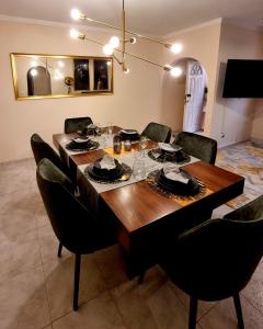 a dining room with a wooden table and chairs at Beach House 29 in Portimão +13 photos