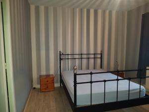 Posteľ alebo postele v izbe v ubytovaní Le garage