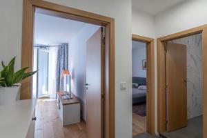 a hallway with a door leading to a bedroom at Designed Apartment in Central Sofia in Sofia