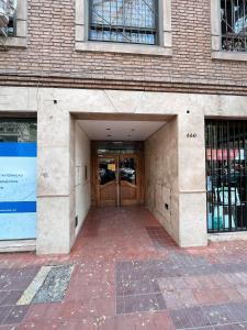 an entrance to a building with a door at Departamentos MITRE in Mendoza