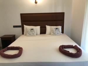 Postel nebo postele na pokoji v ubytování Lemazone Inn