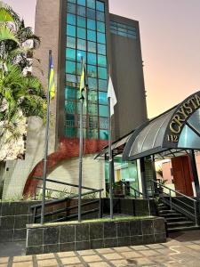 a building with flags in front of it at Crystal Plaza Hotel Marista in Goiânia +42 photos