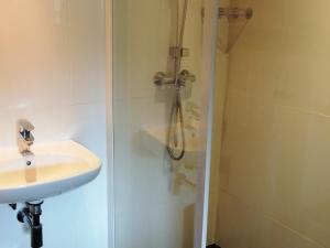 a bathroom with a sink and a shower at Chalet familial rénové 2 étoiles près du centre, 3 chambres, terrasse, parking, WiFi - FR-1-598-16 in Les Gets