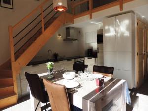 a kitchen with a table with chairs and a dining room at T3 aux Gets, vue sur pistes - FR-1-598-5 in Les Gets