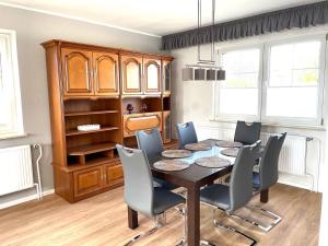 a dining room with a table and chairs at Ferienhaus Rupnow Plau am See in Plau am See