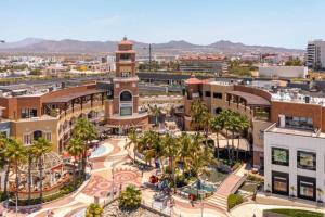 an aerial view of a city with a clock tower at Amazing Cabo Marina condo with private jacuzzi in Cabo San Lucas