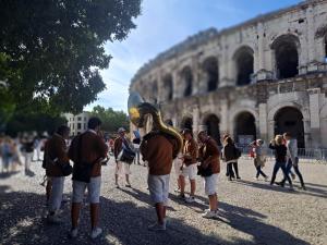 a group of people standing in front of a building at Hôtel Abalone - Centre Gare in Nîmes