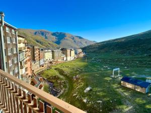 a view from a balcony of a city with a soccer field at Prime Loft ANDORRA HUT2-06207 in Pas de la Casa
