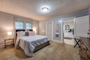 a bedroom with a bed and a mirror in it at Moody Woods in Orange Park