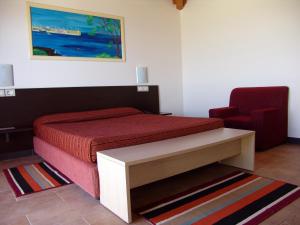 Łóżko lub łóżka w pokoju w obiekcie Hotel Santantao Art Resort