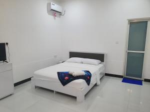 Postel nebo postele na pokoji v ubytování Mulimathi Lodge