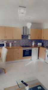 a kitchen being remodeled with a stove and a chair at Plaza lodge in Gillingham