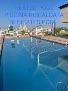a swimming pool on top of a building at Almalux Jesolo Wellness & Spa 3 stelle superior in Lido di Jesolo