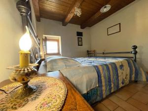 En eller flere senge i et værelse på Agriturismo Le Castellare