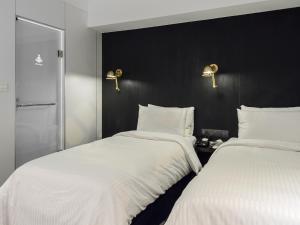 Katil atau katil-katil dalam bilik di Hotel Relax III