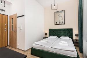 Posteľ alebo postele v izbe v ubytovaní NovaNest Apartments - Kalwaryjska - by Upstairs