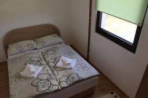 Postel nebo postele na pokoji v ubytování Vila Ana + 2 fotografie