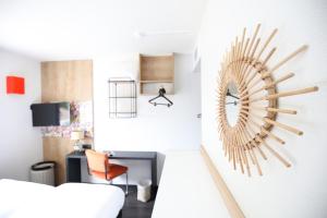 a living room with a large wooden clock on the wall at greet La Teste Bassin d'Arcachon in La Teste-de-Buch