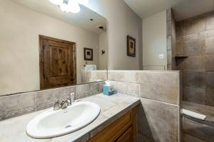 a bathroom with a sink and a mirror at Silver King in Park City