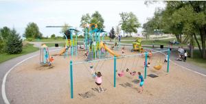 a group of children playing at a playground at WELCOME TO PREMIUM LIVING PLACE / 2 BEDROOMS SUITE in Innisfil