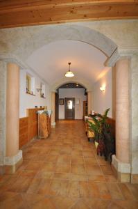 an empty hallway with an archway in a building at Hochkarhof in Göstling an der Ybbs