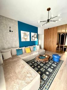 a living room with a couch and a table at Blue Moon Guesthouse in Kamenicë