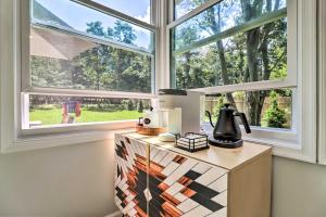 a kitchen with a counter with a window at Game Room, Community Beach Pocono Home! in Albrightsville
