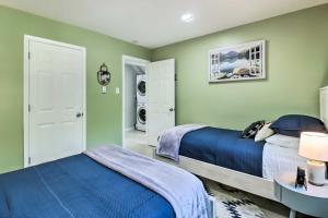 a bedroom with two beds and green walls at Game Room, Community Beach Pocono Home! in Albrightsville