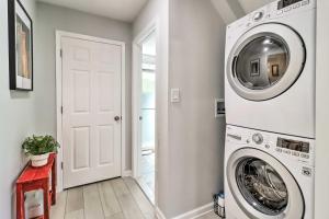 a white laundry room with a washer and dryer at Game Room, Community Beach Pocono Home! in Albrightsville