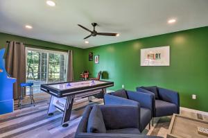 a living room with a ping pong table and chairs at Game Room, Community Beach Pocono Home! in Albrightsville