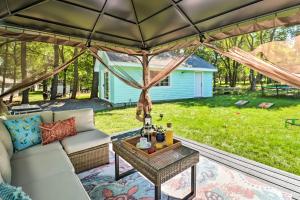 a patio with a couch and a table at Game Room, Community Beach Pocono Home! in Albrightsville