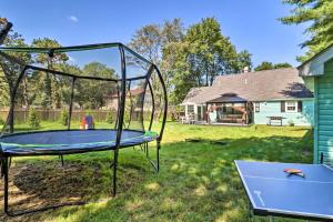 a trampoline in the yard of a house at Game Room, Community Beach Pocono Home! in Albrightsville