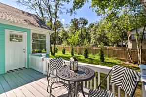 a patio with a table and chairs on a deck at Game Room, Community Beach Pocono Home! in Albrightsville