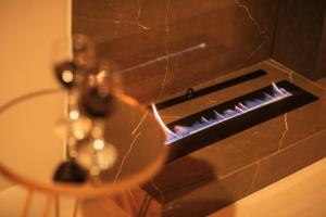 a stove with a glass table in front of it at Casa Requinte Com piscina 02 in Balneário Camboriú