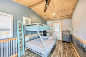 a bunk bed room with two bunk beds and a wooden ceiling at Gun Barrel City Lake House with Boat Launch and Grill! in Gun Barrel City