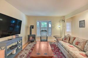a living room with a couch and a tv at Charming Lambertville Retreat - 1 Mi to River! in Lambertville