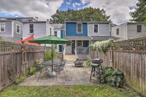 a patio with a table and an umbrella at Charming Lambertville Retreat - 1 Mi to River! in Lambertville