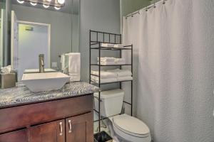 a bathroom with a toilet and a sink and a shower at Furnished Patio and Pool Access Palm Desert Home! in Palm Desert +35 photos