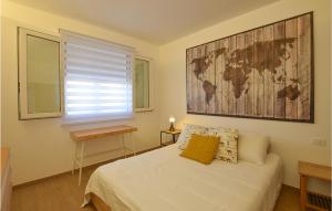 a bedroom with a bed with a map on the wall at Beautiful Apartment In Pozzallo in Pozzallo