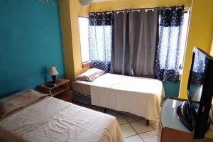 Cómodo apartamento en Naguanagua tesisinde bir odada yatak veya yataklar