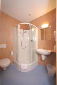 Koupelna v ubytování Tour-Motel