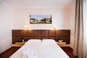 Katil atau katil-katil dalam bilik di Hotel Minerva