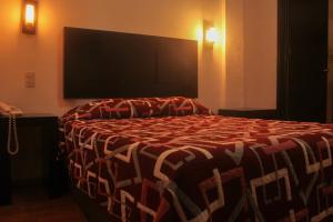 Postel nebo postele na pokoji v ubytování Hotel Alika