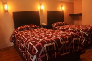 Postel nebo postele na pokoji v ubytování Hotel Alika